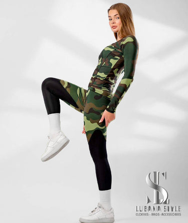 A woman is wearing a green camouflaged sportswear for gym 